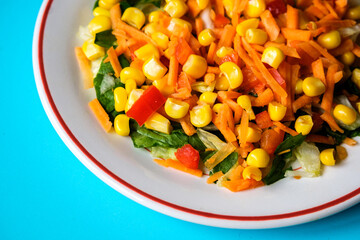 Fresh Refreshiung Summer Salad Of Sweet Corn Carrots Red Peppers and Leaves