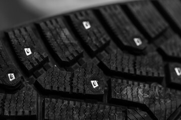 Macro shot of a winter tire showcasing its intricate tread pattern