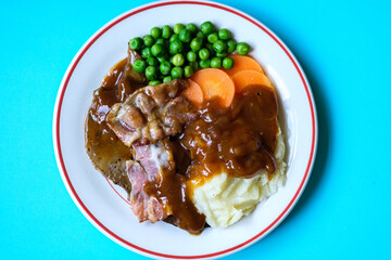 Classic Liver and Bacon With Mash Potatoes Peas Carrots and Onion Gravy