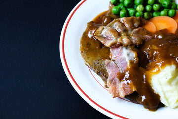 Classic Liver and Bacon With Mash Potatoes Peas Carrots and Onion Gravy