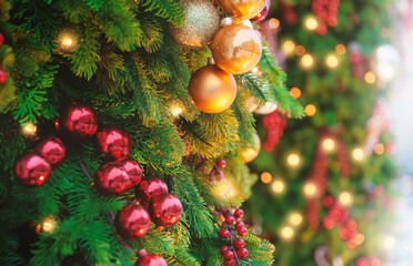 Festive pine tree decoration captured with a bokeh-filled background. Christmas background