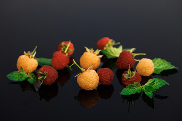 Delicious fresh raspberries on black background. Sweet ripe fresh delicious raspberry, summer...