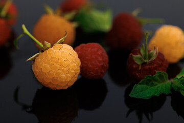Raspberry isolated on black background. Sweet ripe fresh delicious raspberry, summer berry, organic...