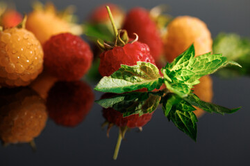 Sweet ripe fresh delicious raspberry, summer berry, organic food, vitamins. Raspberry with leaves....