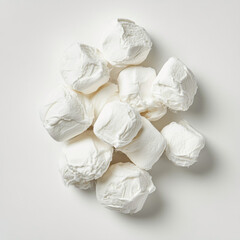Obraz premium A pile of fluffy white marshmallows on a clean white background sweet
