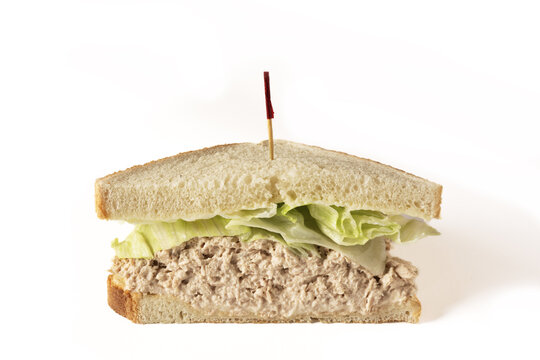 A half of a tuna salad sandwich on white background