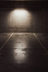 Empty parking lot with overhead dim light