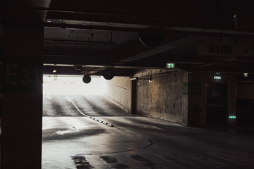 Empty parking lot with overhead dim light