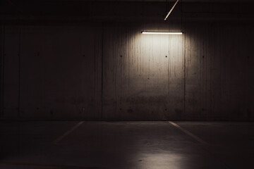 Empty parking lot with overhead dim light