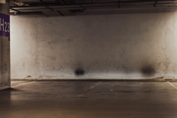 Empty parking lot with overhead dim light