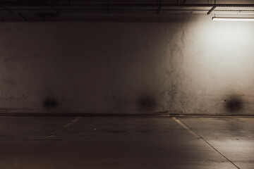Empty parking lot with overhead dim light