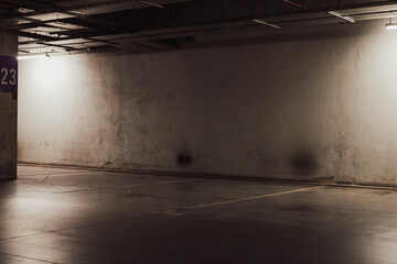 Empty parking lot with overhead dim light