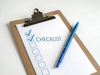 A clipboard with a checklist and checkmarks and a blue pen on a white surface in a close up view