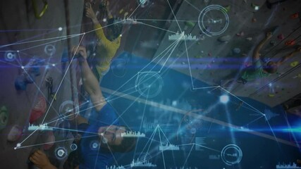 Climbers gripping low holds while ascending wall and generating fitness charts tracking performance