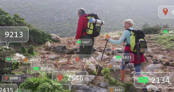 Hiker couple ascending rocky trail using fitness tech showing floating location pins step counters