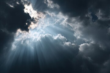 Dramatic sky with sunlight breaking through dark clouds