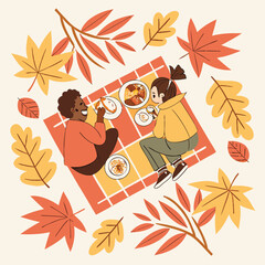 Two people enjoying a picnic on a blanket surrounded by colorful autumn leaves in a square composition