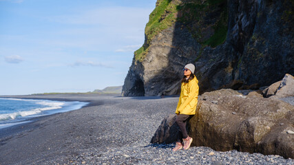 Exploring the stunning Reynisfjara Beach in Iceland with breathtaking cliffs and waves