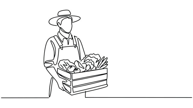 Farmer wearing a hat and overalls holds a wooden crate filled with fresh vegetables