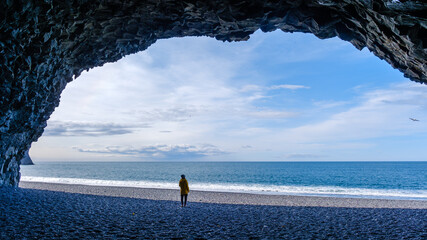 Explore the mystical Reynisfjara Beach with stunning rock formations and vibrant ocean waves