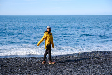 Explore the beauty of Reynisfjara Beach with a stroll along the stunning black sand shoreline