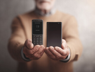 Elderly hands hold old  new cell phones, showcasing tech evolution. Represents progress, generational change, user experience  connectivity. For seniors  tech topics.