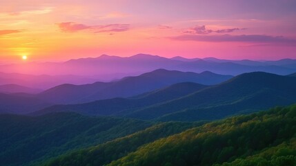 Fototapeta premium Blue Ridge Mountains at sunset from Blue Ridge Parkway. Amazing nature scenery with layered mountain ranges, green forests, colorful pink, orange sky. Beautiful scenic landscape. Perfect for travel,