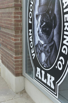 sign outside Animal Liberation Kitchen or ALK, a vegan restaurant, located at 100 Broadview Av, Unit 202, Toronto (inside The Ninety Lofts)