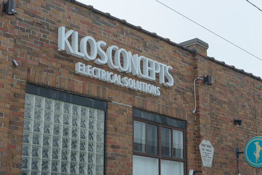 exterior building facade and sign of Klos Concepts Ltd, a Toronto-based electrical solutions provider located at 12 Logan Ave, Toronto,