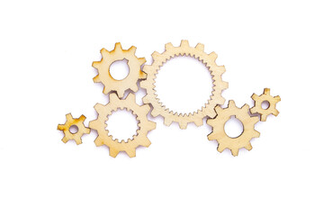 Wooden cogwheels on white background	
