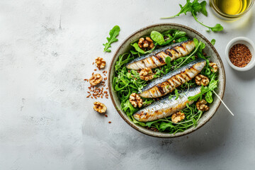 Three grilled sardines on arugula with walnuts and flax seeds