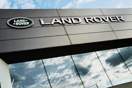 Name Sign, Brand Logo, Jaguar Land Rover (JLR) Automotive Car Showroom Exterior, Acton Park Royal, London, United Kingdom - 2025