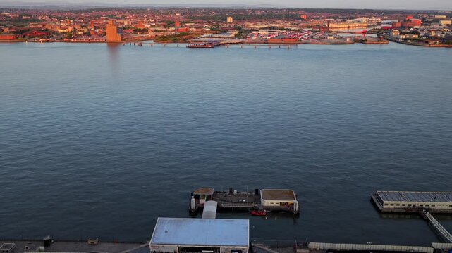 Aerial video featuring Birkenhead docks in the morning from the vantage point of Liverpool. 