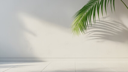 minimalistic background with blurred foliage shadow on white wall and palm leaves
