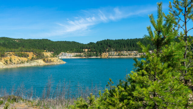 Abandoned Lipovsky nickel quarry near of city Rezh, Sverdlovsk region, the Urals with turquoise water in Lipovskiy Geological Park. Natural and mineralogical reserve Rezhevskoy