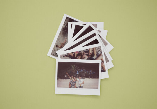 Stacked polaroids frames lie on a surface. PSD template mockup. Background color change available