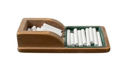 Isolated close-up image of freshly sharpened white chalk sticks in a chalk holder placed on a tray, perfect for transparent background use