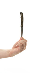 Hand holding a pocket knife with intricate design in a minimalist setting