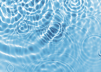 Abstract blurred shades of blue water background. Light and shadow ripples or splashes surface of water texture. Water waves with shining and reflection pattern photography for​ design artwork.