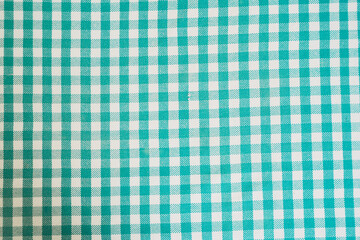 Green background. Blue and White Checkered Fabric Pattern Suitable for Tablecloths, Crafts, or Home Decor Projects and Accessories