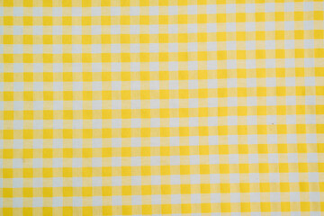 Yellow background. Yellow and White Gingham Fabric Texture for Background, Craft, and Fashion...