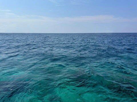Endless sea and blue sky to the distant horizon.