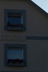 On the side of the building, you will see the word studio prominently displayed, catching the...