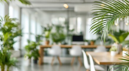 Blurred view of a modern office with many plants