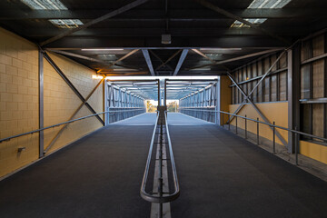 Photograph of the bridge walkway that provides fans with access to the Mount Panorama Racing circuit track and paddock in Bathurst from one of the main spectator entrance gates.
