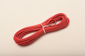 A coil of copper wire. Bundles of connecting wires.