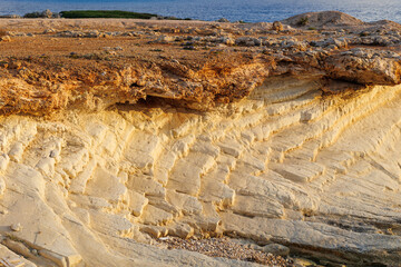 Eroded Coastal Cliffs by the Mediterranean Sea, Golden coastal rock formations shaped by erosion,...