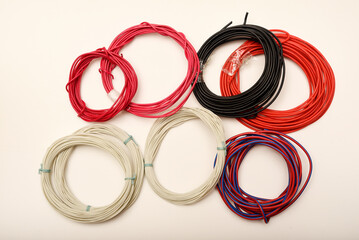 Bundles of copper connecting wires in rubber insulation. Multicolored wires.