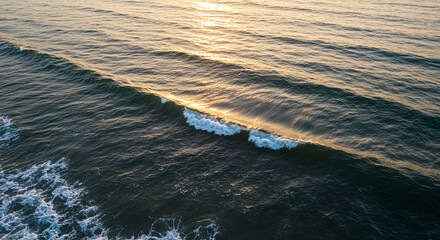 Ocean Wave Breaking at Sunrise