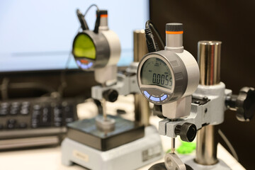 Several control and measuring instruments are on display at a trade fair for industrial tools and machinery.